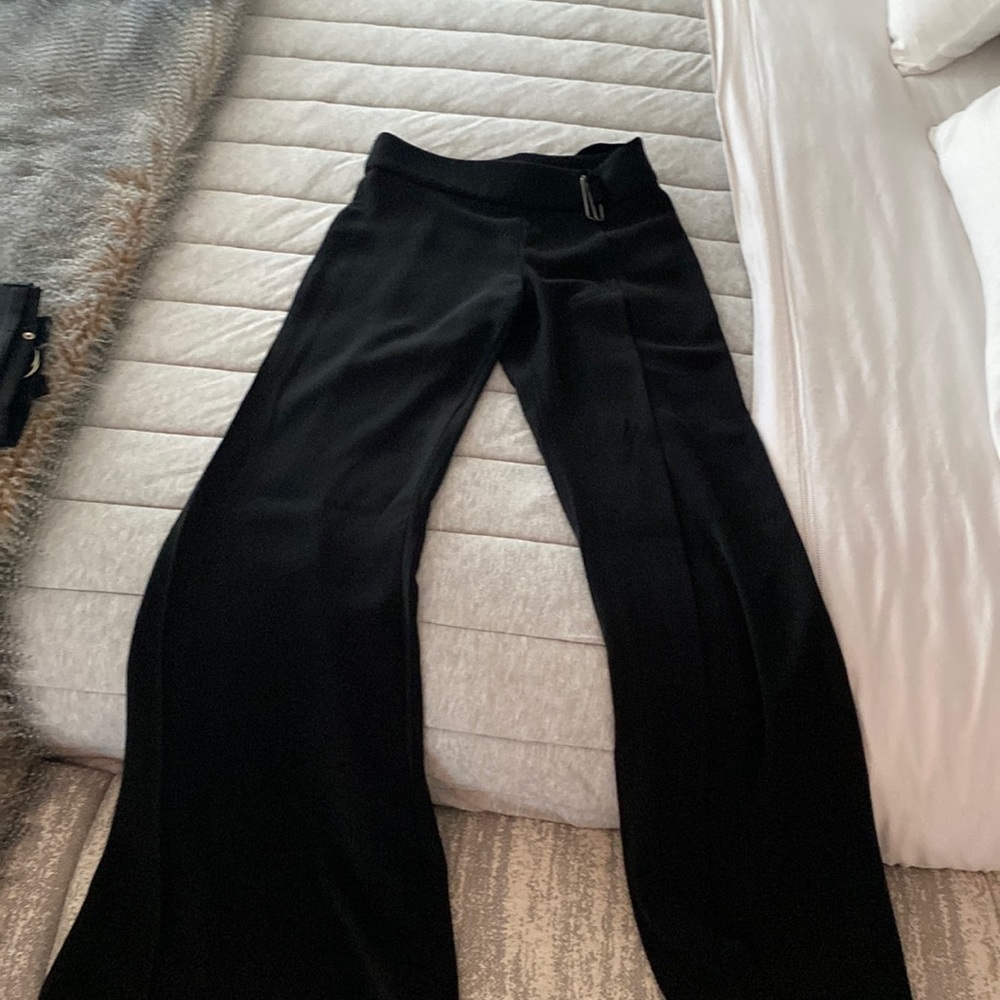 Bebe size 2 dressy pants. Has zipper, has a belt, open on the right leg.
